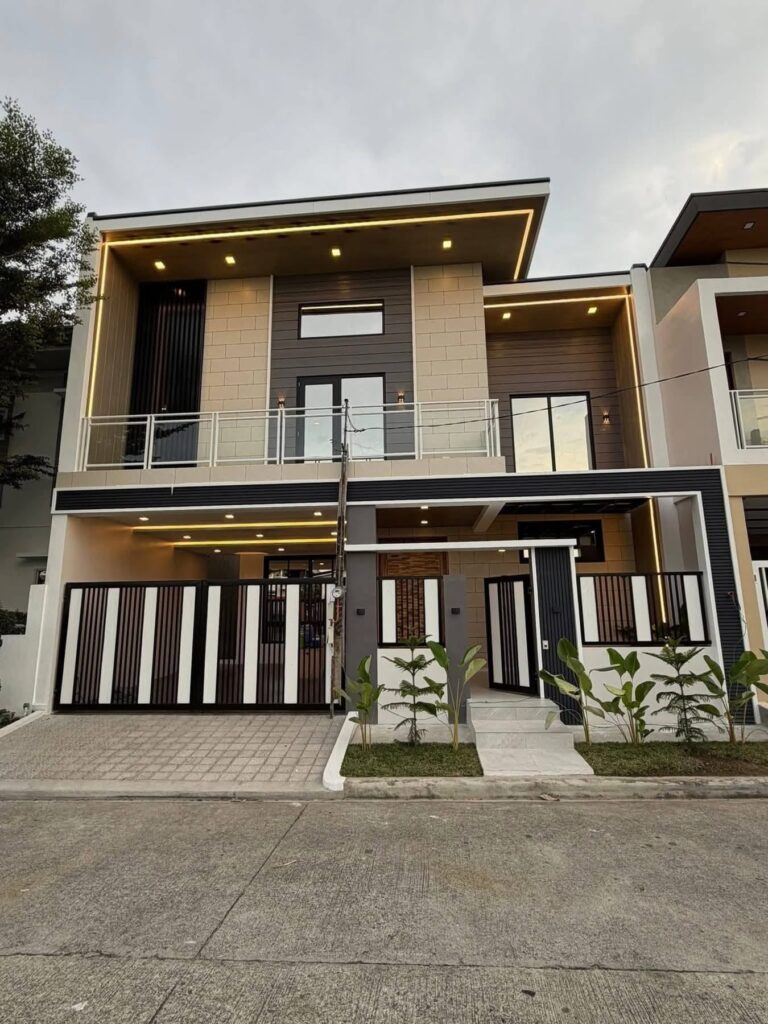 Front view of furnished house for sale in Angeles City near Clark with high ceiling living area and 2-car carport