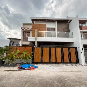 Front view of fully furnished 5-bedroom smart home for sale in Angeles City with 2-car parking