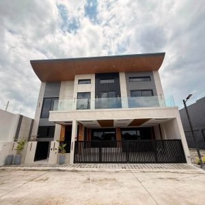 Front exterior of modern 5-bedroom home for sale near Clark with 3-car parking