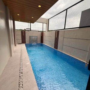 Private swimming pool of modern 5-bedroom home for sale near Clark